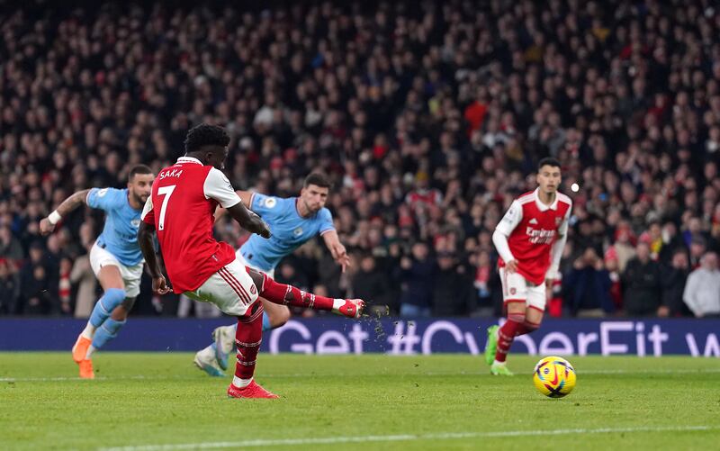 Arsenal's Bukayo Saka scores from the spot. PA