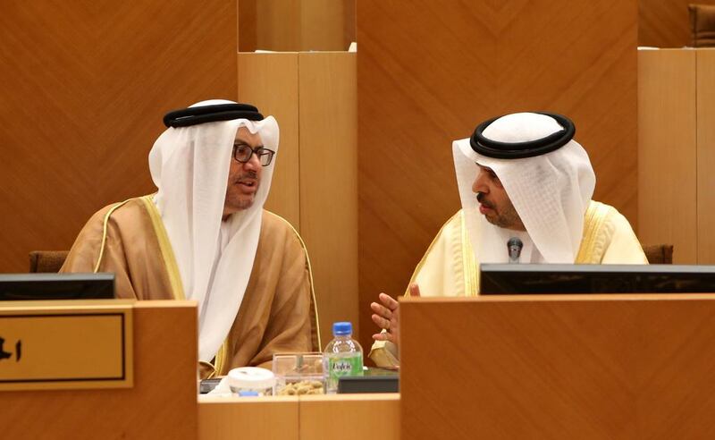 Dr Hadef Al Dhaheri, Minister of Justice, left, with Dr Anwar Gargash, Minister of State for FNC Affairs at the council session on May 20, 2014. Fatima Al Marzooqi / The National