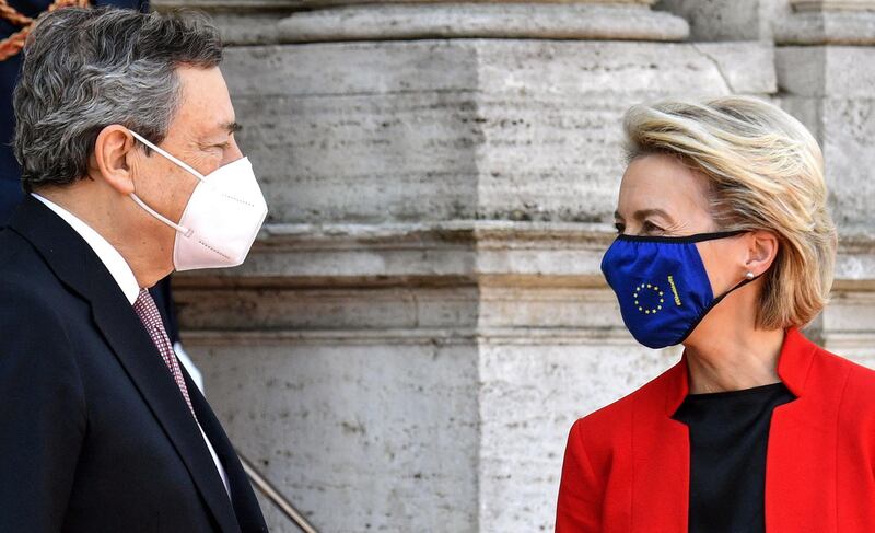 Italian Prime Minister Mario Draghi (L) and European Commission President Ursula von der Leyen talk upon arrival for the Global Health Summit at the Villa Doria Pamphili in Rome on May 21, 2021, to discuss on how to recover from the Covid-19 pandemic and how to prevent it happening again. The EU is expected to announce a new initiative to support local manufacturing in Africa as the leaders emphasise the importance of scaling up vaccination efforts, including through the Covax vaccine-sharing programme. / AFP / Tiziana FABI                        
