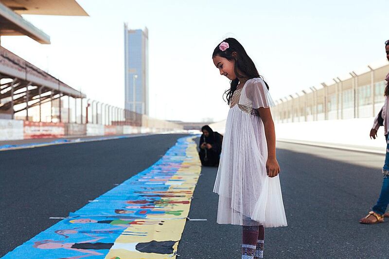 The Al Tayer Group and Dubai Autism Centre have set a new world record for the world’s longest painting, which was designed to increase awareness about autism in local communities. Anna Nielsen for The National