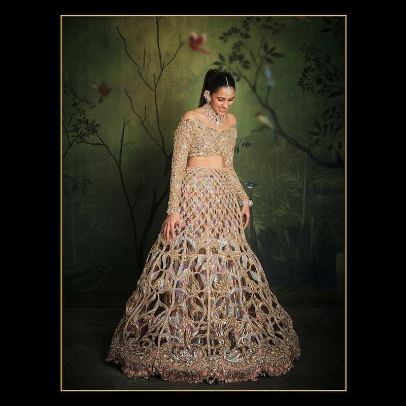 Shloka Mehta, Anant's sister-in-law also dazzled in a custom made lehenga with patterns made in a "cage cutout" style that took 8,000 hours to make. Photo: @manishmalhotra05 / Instagram