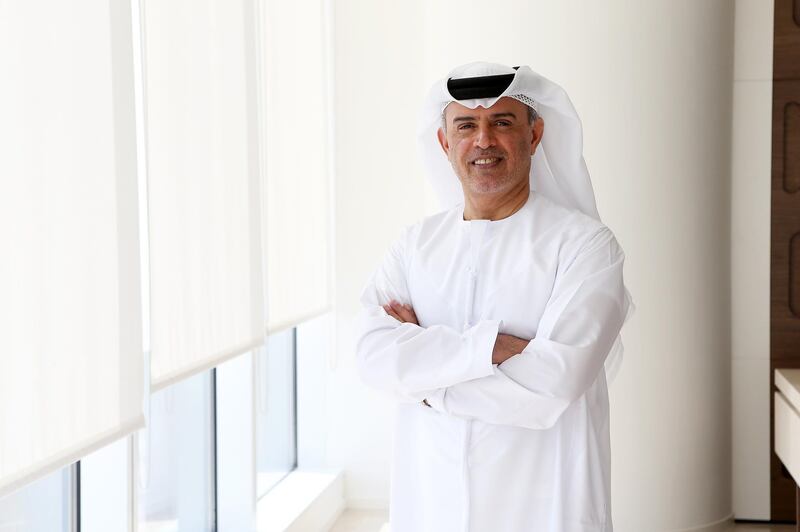 DUBAI , UNITED ARAB EMIRATES – Dec 15 , 2016 : Hussain Ali Lootah , author of ‘ Between two Wives’  at his office in Vision Tower 1 in Downtown Dubai in Dubai. ( Pawan Singh / The National ) For Review. Story by Rym Ghazal. ID No -  38741 *** Local Caption ***  PS1512- HUSSAIN ALI LOOTAH02.jpg