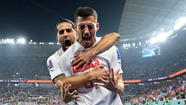 Switzerland's midfielder #08 Remo Freuler (R) celebrates with Switzerland's defender #13 Ricardo Rodriguez after scoring his team's third goal during the Qatar 2022 World Cup Group G football match between Serbia and Switzerland at Stadium 974 in Doha on December 2, 2022.  (Photo by JAVIER SORIANO  /  AFP)