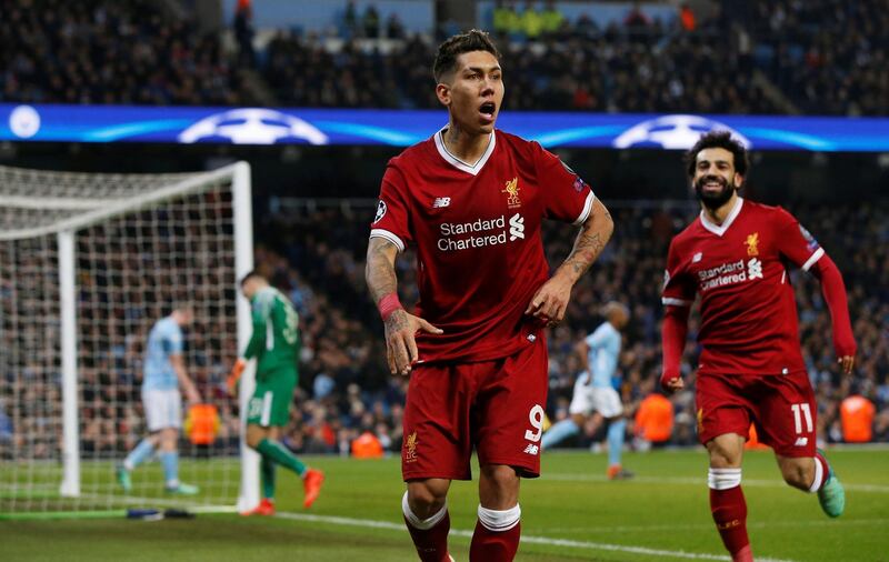 Soccer Football - Champions League Quarter Final Second Leg - Manchester City vs Liverpool - Etihad Stadium, Manchester, Britain - April 10, 2018   Liverpool's Roberto Firmino celebrates scoring their second goal with Mohamed Salah    REUTERS/Andrew Yates