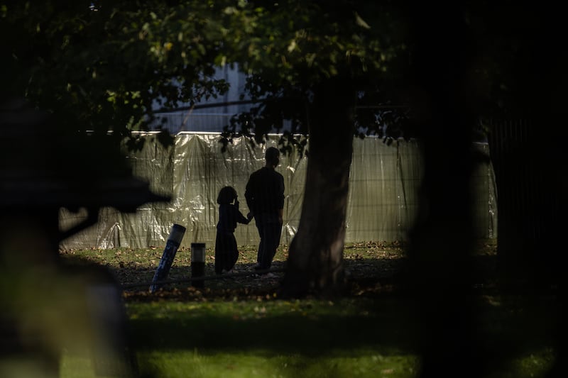 A man and a young child pictured at the Manston immigration facility in Kent. Getty