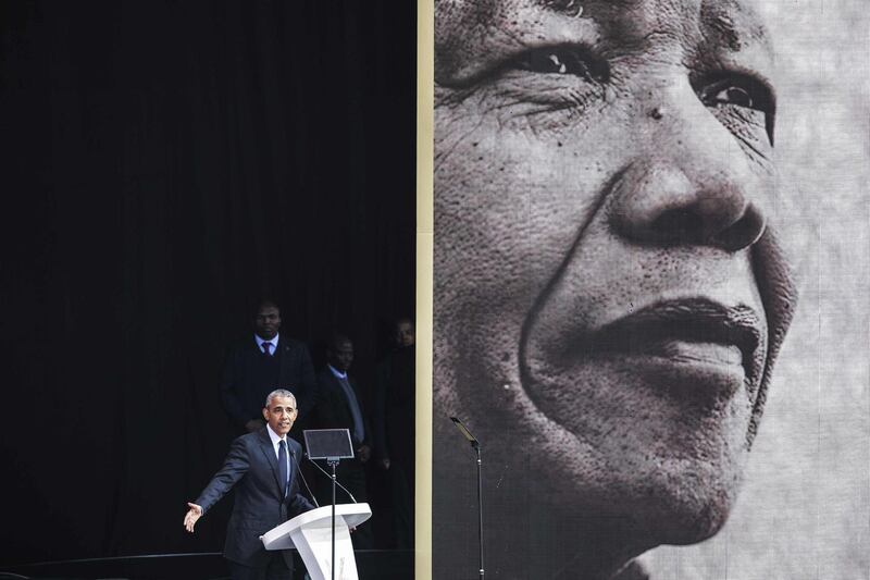 Former US President Barack Obama speaks during the 2018 Nelson Mandela Annual Lecture at the Wanderers cricket stadium in Johannesburg on July 17, 2018. Former US president Barack Obama will deliver the Nelson Mandela Annual Lecture, urging young people to fight to defend democracy, human rights and peace, to a crowd of 15,000 people at the club as the centrepiece of celebrations marking 100 years since Nelson Mandela's birth. Obama has made relatively few public appearances since leaving the White House in 2017, but he has often credited Mandela for being one of the great inspirations in his life.
 / AFP / GIANLUIGI GUERCIA
