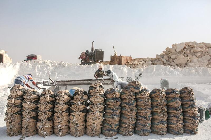 Bags filled with limestone powder are arranged for transport at quarry in the desert of Minya, Egypt. Mosa'ab Elshamy / AP Photo