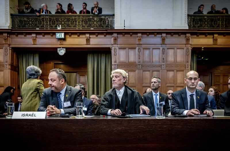 From left, Israeli Foreign Ministry adviser Tal Becker, lawyer Malcolm Shaw and Gilad Noam, deputy attorney general for international affairs, at the International Court of Justice in The Hague. AFP