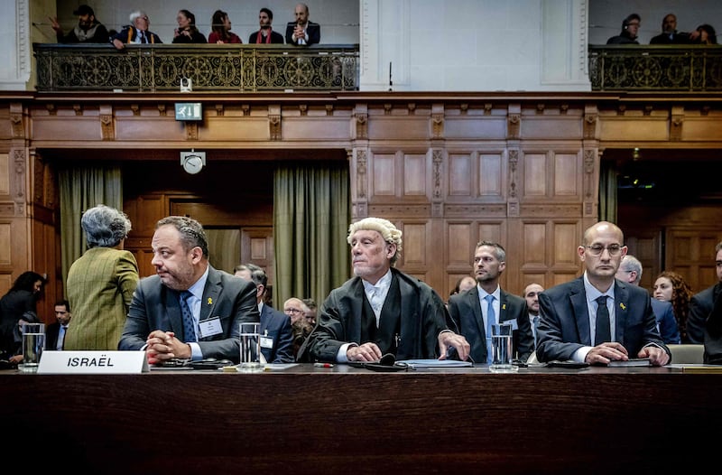 From left, Israeli Foreign Ministry adviser Tal Becker, lawyer Malcolm Shaw and Gilad Noam, deputy attorney general for international affairs, at the International Court of Justice in The Hague. AFP