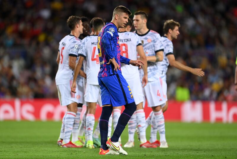 Barcelona's Gerard Pique looks dejected after Thomas Muller scored for Bayern Munich to make it 3-0 in the Champions League group-stage game at Camp Nou, on Tuesday, September 15. Getty