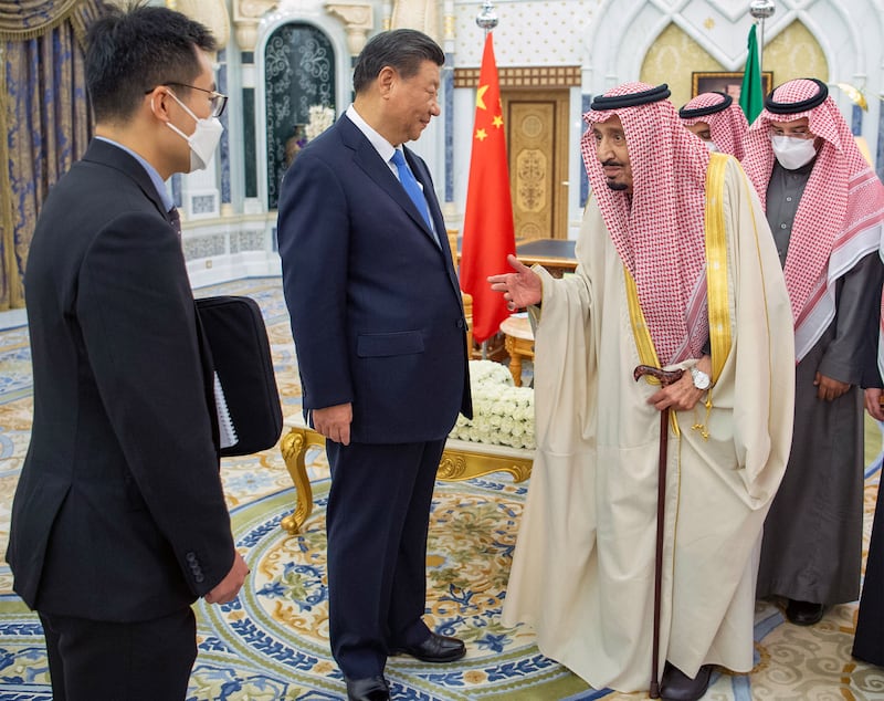 Saudi Arabia's King Salman welcomes Mr Xi to Riyadh. EPA