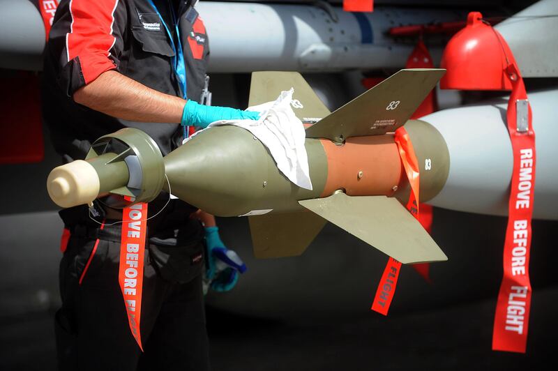 An employee cleans an Eurofighter Typhoon airplane at the Paris International Air Show -- June 14, 2013 -- . (Antoine Antoine for The National) *** Local Caption ***  Paris Air Show030.JPG