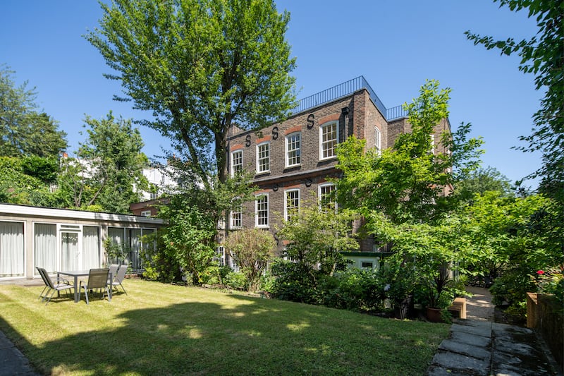 Frognal House's garden is partly enclosed by a wall, giving added privacy