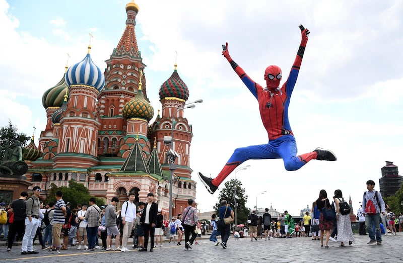 A Spiderman jumps in front of Saint Basil's Cathedral in Red Square in Moscow on June 26, 2018. Franck Fife / AFP