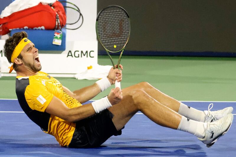 Jiri Vesely celebrates after defeating Novak Djokovic in their quarter-final match at the Dubai Duty Free Tennis Championships. AFP