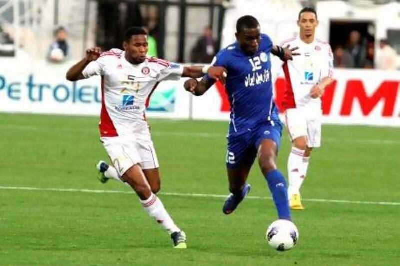 Jlloyd Samuel, right, and his Esteghlal teammates found themselves outhustled by Subait Khater, let, and Al Jazira when the clubs met in Tehran.