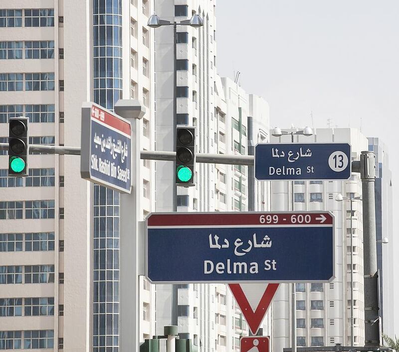 Delma Street and 13th – hybrid signs putting travellers to Abu Dhabi right. Mona Al Marzooqi / The National