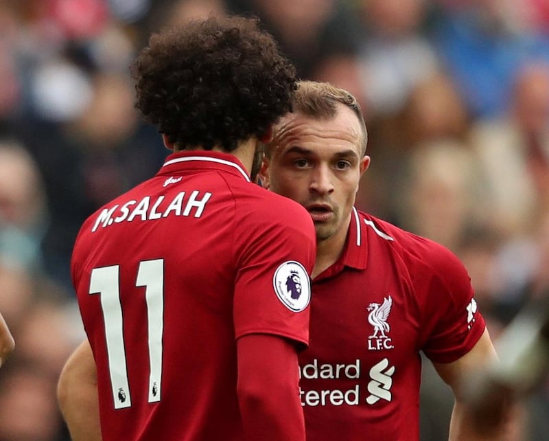 Soccer Football - Premier League - Liverpool v Southampton - Anfield, Liverpool, Britain - September 22, 2018  Liverpool's Xherdan Shaqiri speaks with teammate Mohamed Salah before taking a free-kick  Action Images via Reuters/Lee Smith  EDITORIAL USE ONLY. No use with unauthorized audio, video, data, fixture lists, club/league logos or "live" services. Online in-match use limited to 75 images, no video emulation. No use in betting, games or single club/league/player publications.  Please contact your account representative for further details.