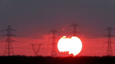 High-voltage power lines and electricity pylons along a motorway north-east of Cairo, Egypt. Reuters