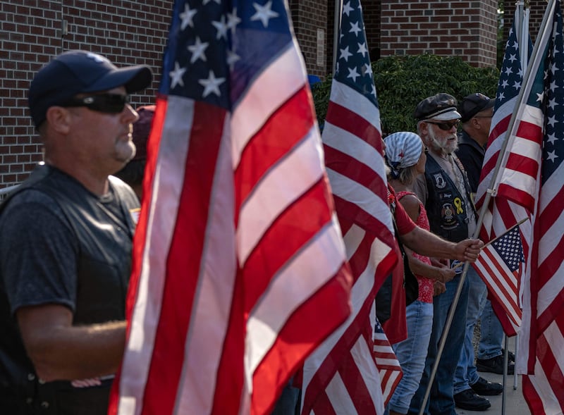 US Army veterans hold flags as they attend a vigil for Soviak at Edison Middle School in Berlin Heights, Ohio. AFP