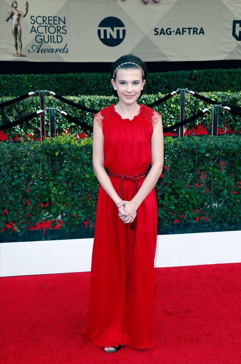 Millie Bobby Brown, wearing red Giorgio Armani, arrives for the Screen Actors Guild Awards in Los Angeles on January 29, 2017.  EPA