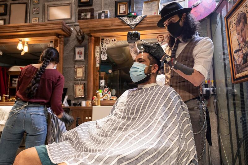 DUBAI, UNITED ARAB EMIRATES. 04 JUNE 2020. Barbers at Möto Barber in Al Quoz were back to 100% capacity for cutting hair and beards today after a slow return to business. During the Lockdown they were fully closed but have seen a massive demand in their services as people have been allowed to leave their homes again. (Photo: Antonie Robertson/The National) Journalist: None. Section: National.