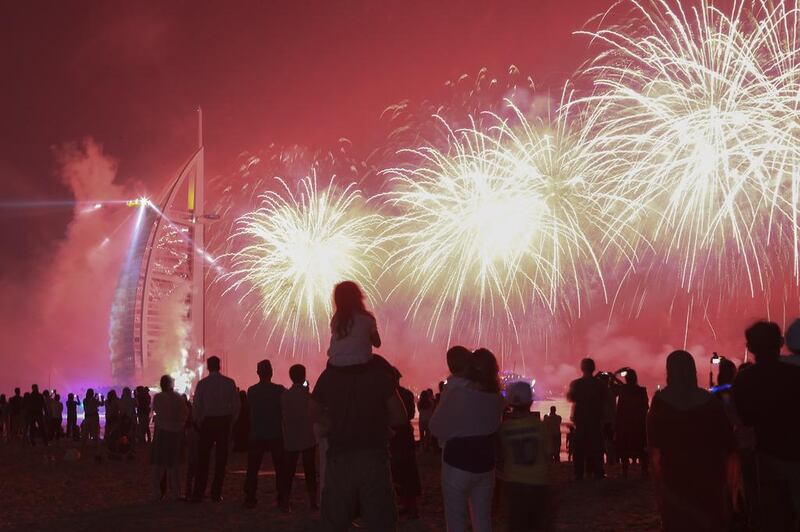 Fireworks celebrating the UAE's 42nd National Day explode over the Burj Al Arab near Umm Suqiem Beach in Dubai. Sarah Dea/The National

