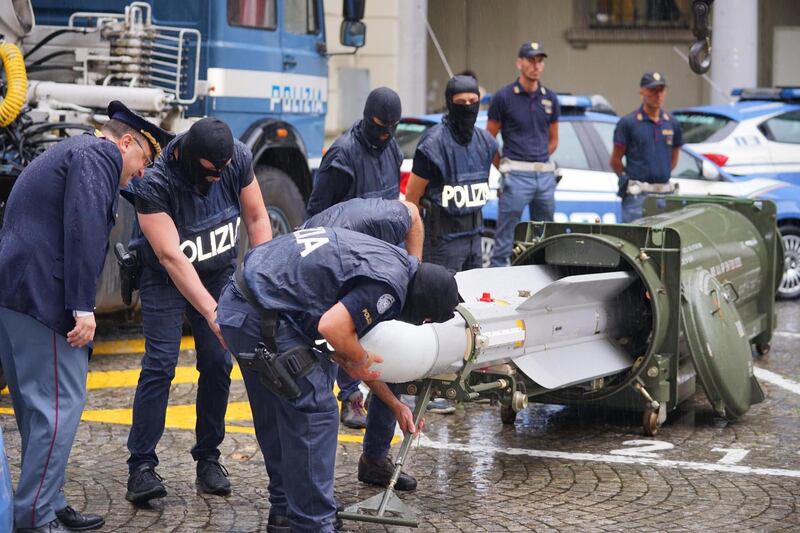 epaselect epa07718381 Special Forces of the anti-terrorist police officers inspect an air-to-air missile seized during an operation against the extreme right in Turin, Italy, 15 July 2019. War weapons were seized from far right groups in various cities in northern Italy on Monday. Three arrests were made.  EPA/TINO ROMANO