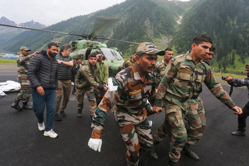 Rescuers tend to the injured. AFP