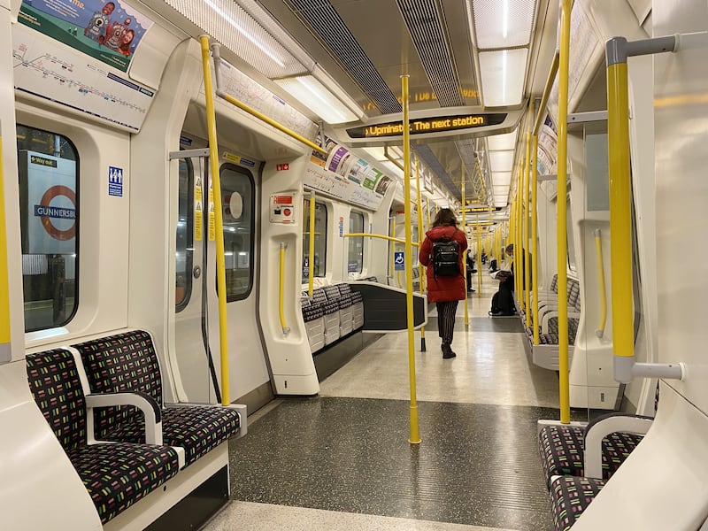 Empty seats on an early morning commuter train on the District Line, in west London, the morning after Mr Johnson announced that work-from-home guidance will return on Monday. PA