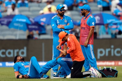 India's Hardik Pandya receives medical attention after sustaining the ankle injury which has ultimately ended his World Cup. Reuters 