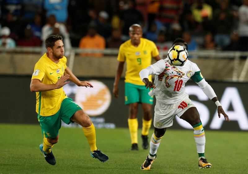 Soccer Football - 2018 World Cup Qualifiers - South Africa v Senegal - Peter Mokaba Stadium, Polokwane, South Africa - November 10, 2017   Senegal's Sadio Mane in action with South Africa's Dean Furman. REUTERS/Siphiwe Sibeko