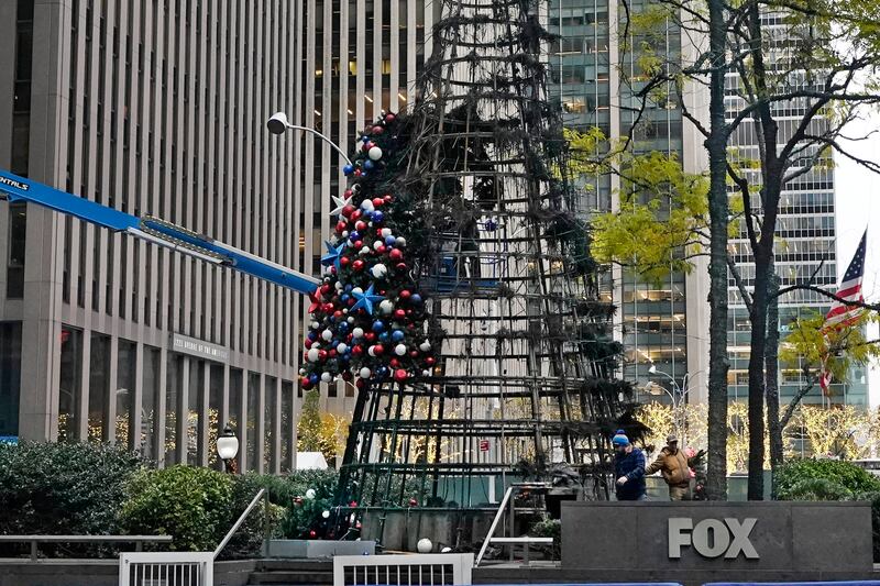 The artificial tree outside of the News Corp building caught fire shortly after midnight, police said. AP