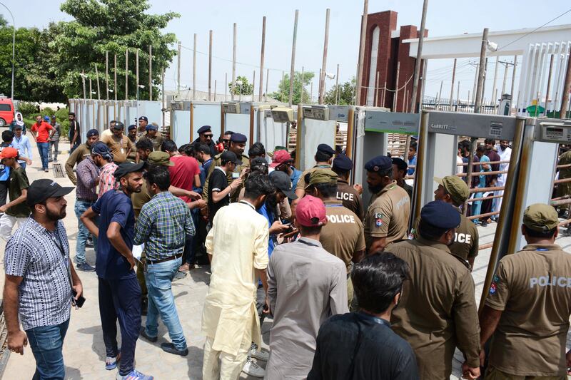 Spectators go through security checks before the match between Pakistan and Nepal at the Multan Cricket Stadium. AFP