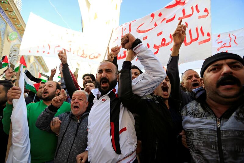 Iraqis shout slogans during a protest at the Abu Hanifa mosque in Baghdad's Adhamiyah district on December 8, 2017. Thaier Al Sudani / Reuters