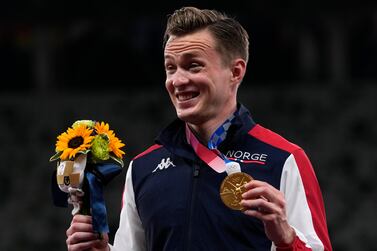 Karsten Warholm, of Norway, poses with his gold medal after winning the men's 400-meter hurdles at the 2020 Summer Olympics, Tuesday, Aug.  3, 2021, in Tokyo.  (AP Photo / Francisco Seco)