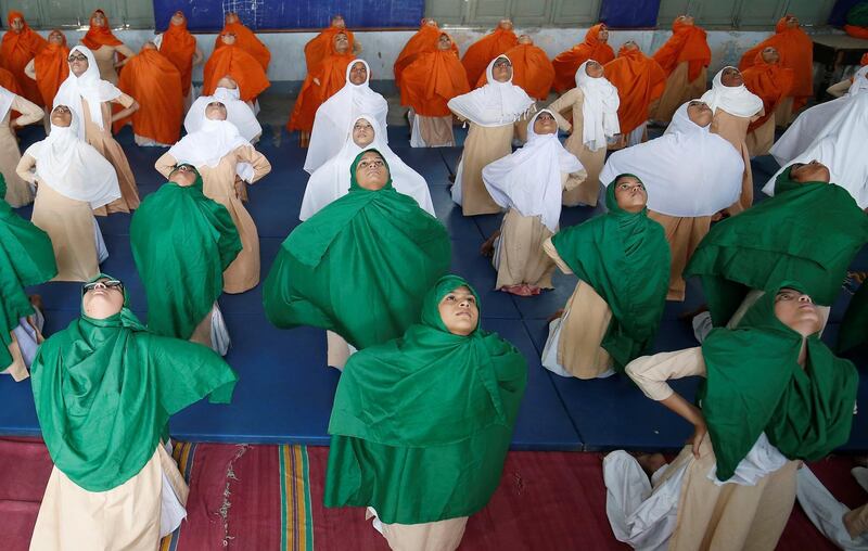 Indian Muslim girls attend a yoga lesson at a school ahead of International Yoga Day in Ahmedabad, India. Amit Dave / Reuters