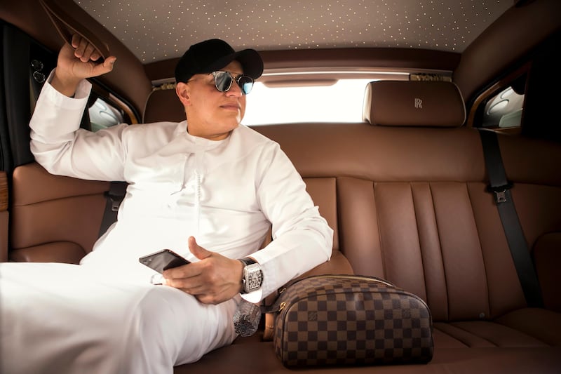 DUBAI, UNITED ARAB EMIRATES - JULY 25: 

Balwinder (Raj) Sahni, owner of RSG International, in his Rolls Royce. The multimillionaire spent $7m on a D5 number plate last year.

(Photo by Reem Mohammed/The National)

Reporter: Suzanne Clocke
Section: BZ