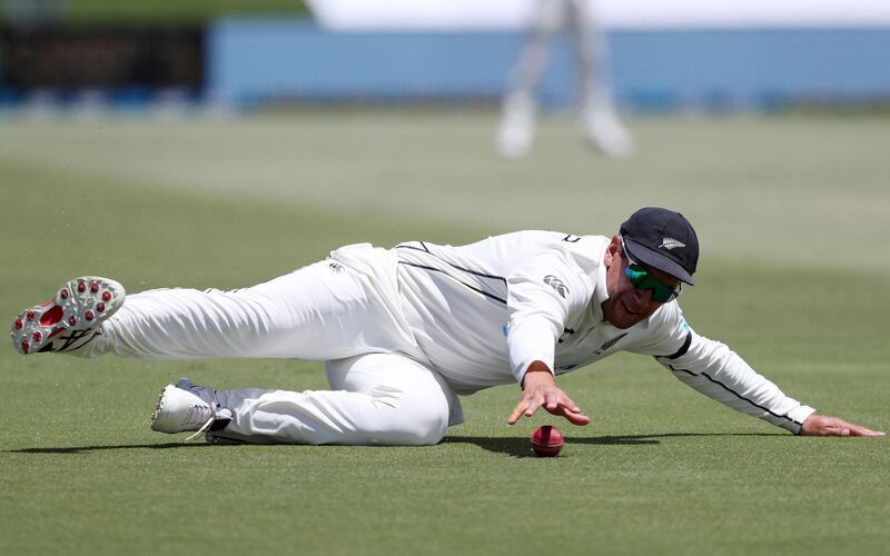New Zealand’s Ross Taylor dives to stop the ball while fielding. AFP