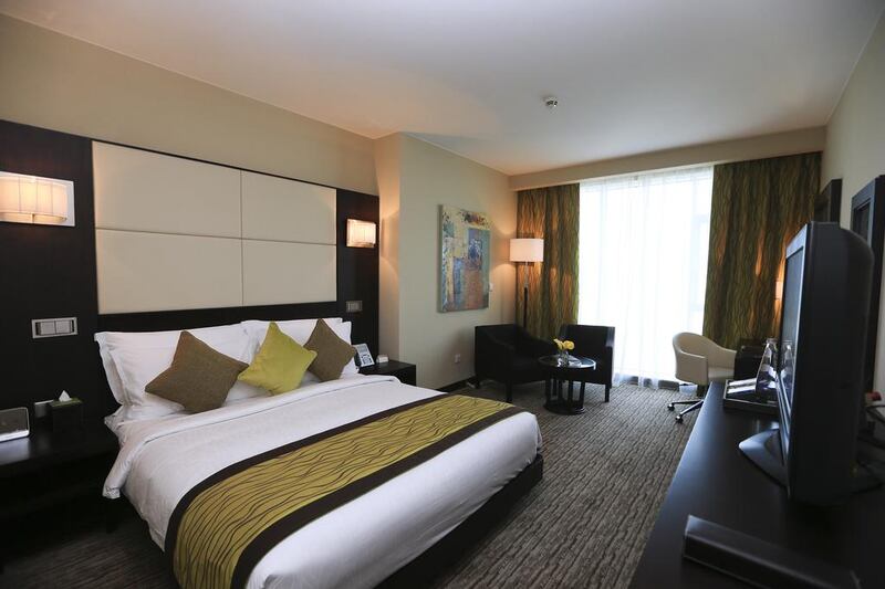 A superior standard room in Movenpick Jumeirah Lakes Towers in DubaiSarah Dea / The National





