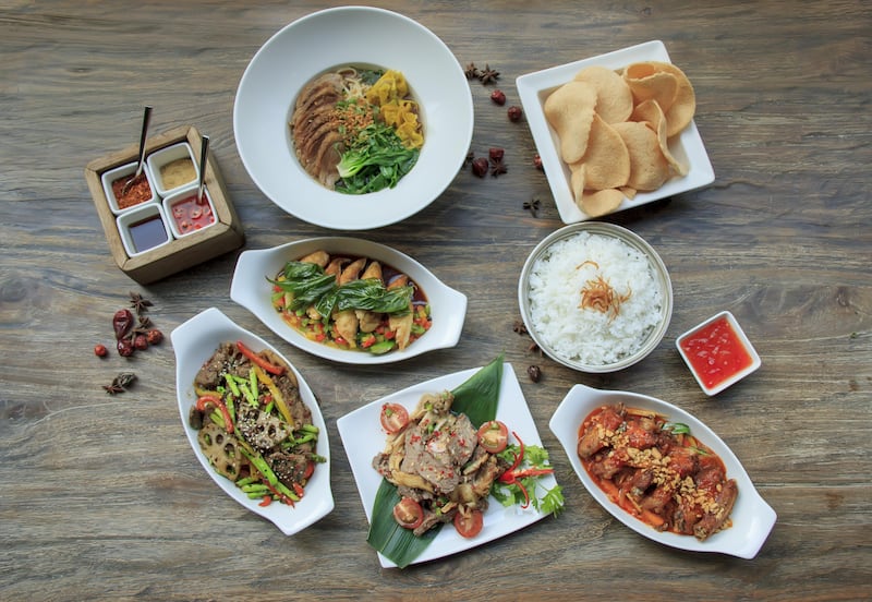 New dishes at Cho Gao include Asian beef salad, wok-fried noodles with vegetables and roasted duck with five spices. Courtesy Crowne Plaza