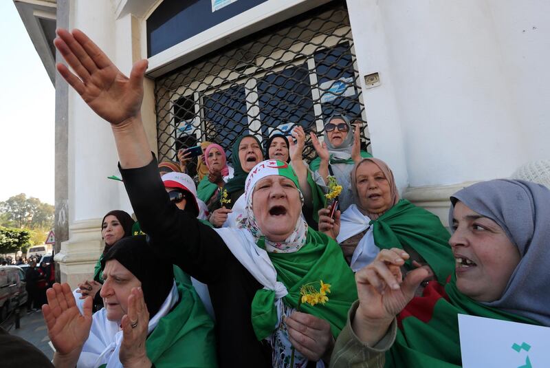 Algerians shout slogans as they march to mark the first anniversary of the popular protests in Algiers, Algeria.  EPA