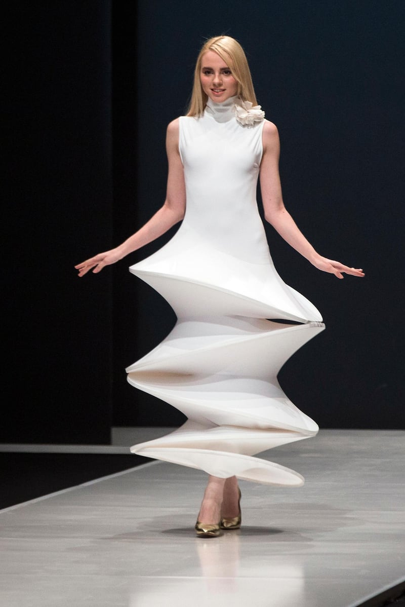 At Moscow Fashion Week March 2016, a model wears a hooped dress by Pierre Cardin. AP