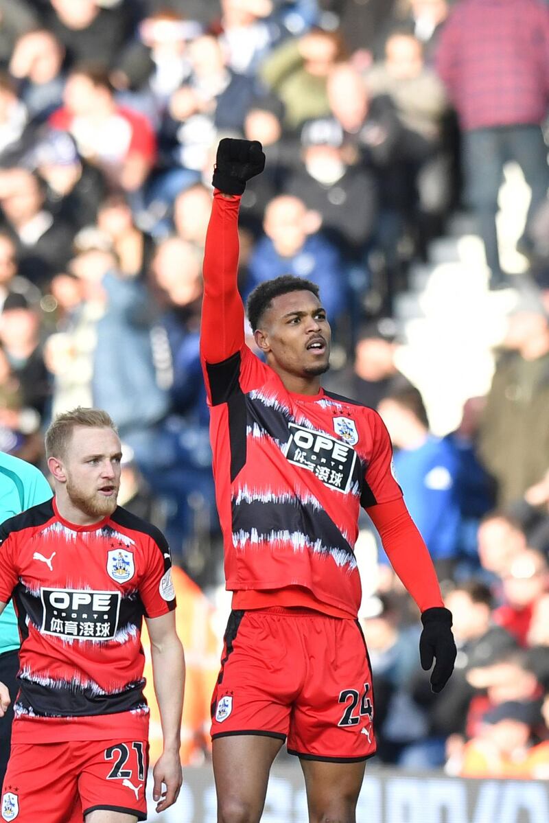 Huddersfield Town's Steve Mounie celebrates scoring his side's second goal of the game during the English Premier League soccer match, West Bromwich Albion against Huddersfield Town at The Hawthorns, West Bromwich, England, Saturday Feb. 24, 2018. (Anthony Devlin/PA via AP)
