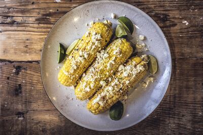 Elote is a dish of corn brushed with sour cream, mayonnaise or Mexican crema, chilli powder, lime juice and Cotija cheese. Courtesy Scott Price