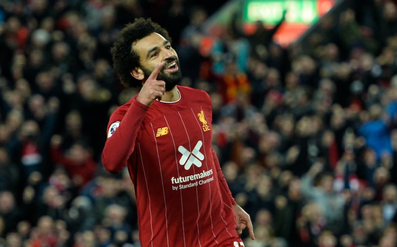 epa07954445 Liverpoolâ€™s Mohamed Salah celebrates after scoring the 2-1 goal during the English Premier League game between Liverpool FC and Tottenham Hotspur in Liverpool, Britain, 27 October 2019.  EPA/PETER POWELL EDITORIAL USE ONLY. No use with unauthorized audio, video, data, fixture lists, club/league logos or 'live' services. Online in-match use limited to 120 images, no video emulation. No use in betting, games or single club/league/player publications.