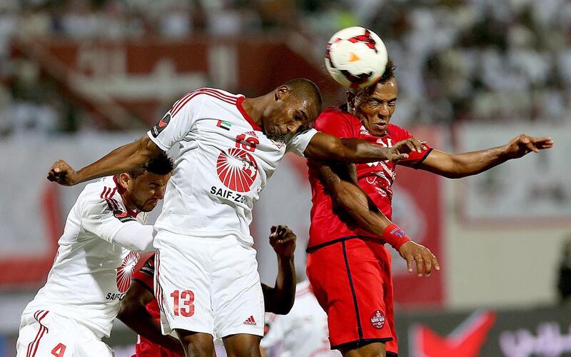 Yousuf Saeed, centre, and his Sharjah side beat neughbours Al Shaab on Thursday night’s Arabian Gulf League derby. Satish Kumar / The National