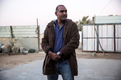 Jaber Abu Queder 51,  head of local council of the unrecognised village of Al-Zarnoug outside his home in the early evening.(Photo by Heidi Levine for The National).