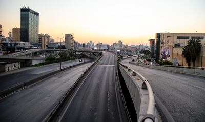 epa08930579 A view of  the empty highway of the northern entrance of Beirut, Lebanon, 10 January 2021. Lebanon on 07 January started a 25-day long nationwide lockdown to help halt the spread of coronavirus.  EPA/NABIL MOUNZER