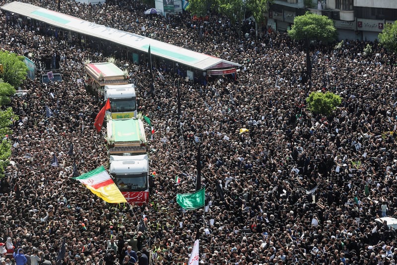 Mourners attend the funeral of victims of the helicopter crash that killed Iran's president Ebrahim Raisi and foreign minister Hossein Amirabdollahian, in Tehran. Reuters